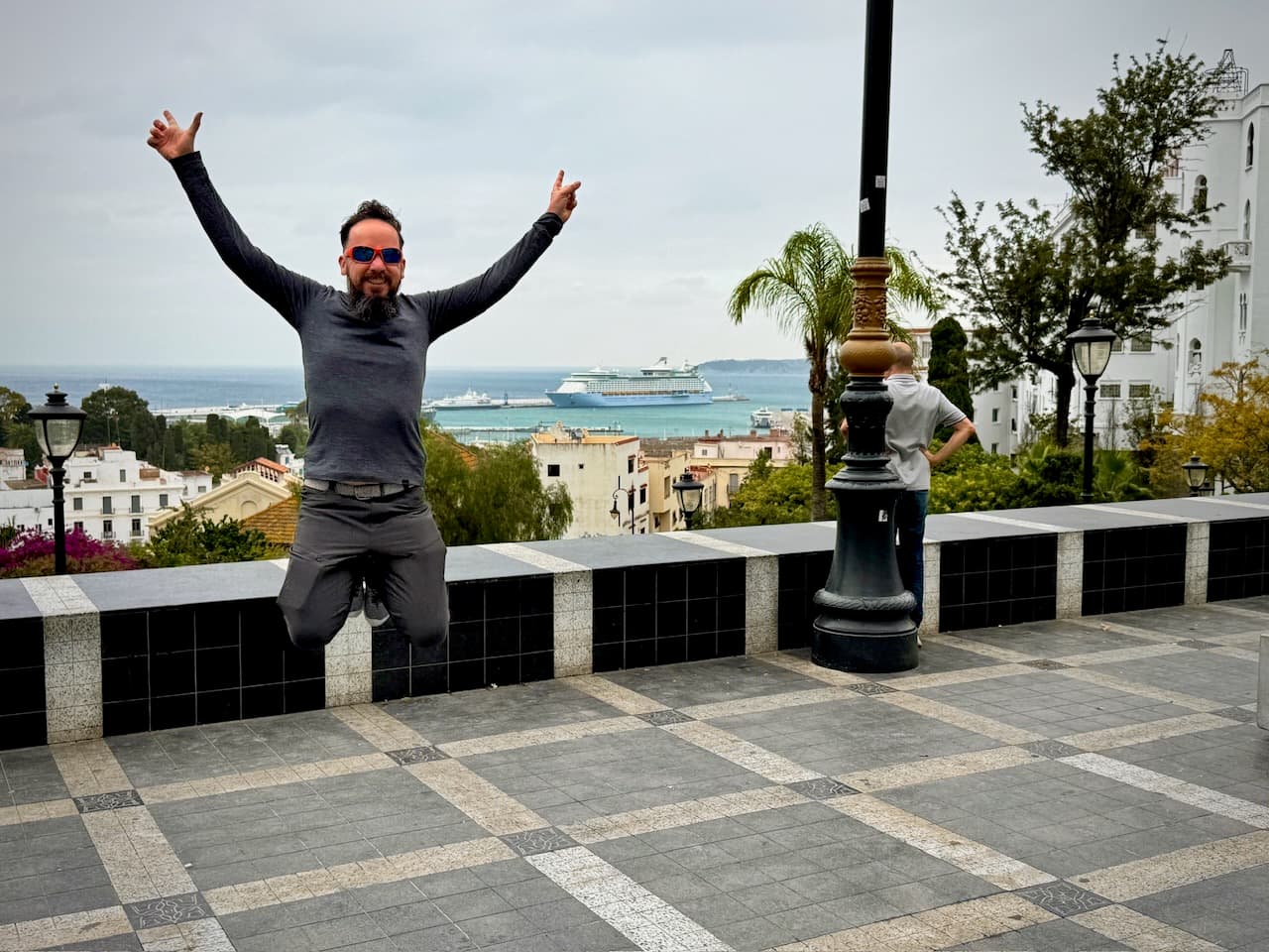 Jumping on a terrace overlooking the port of Tangier, with Voyager of the Seas in the bay