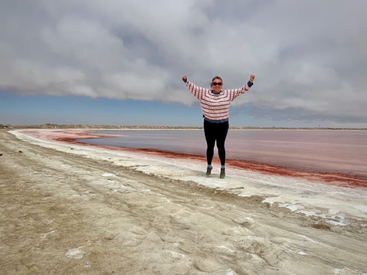 J. jumping on the salt crust at the edge of the pink salt pans of Walvis Bay