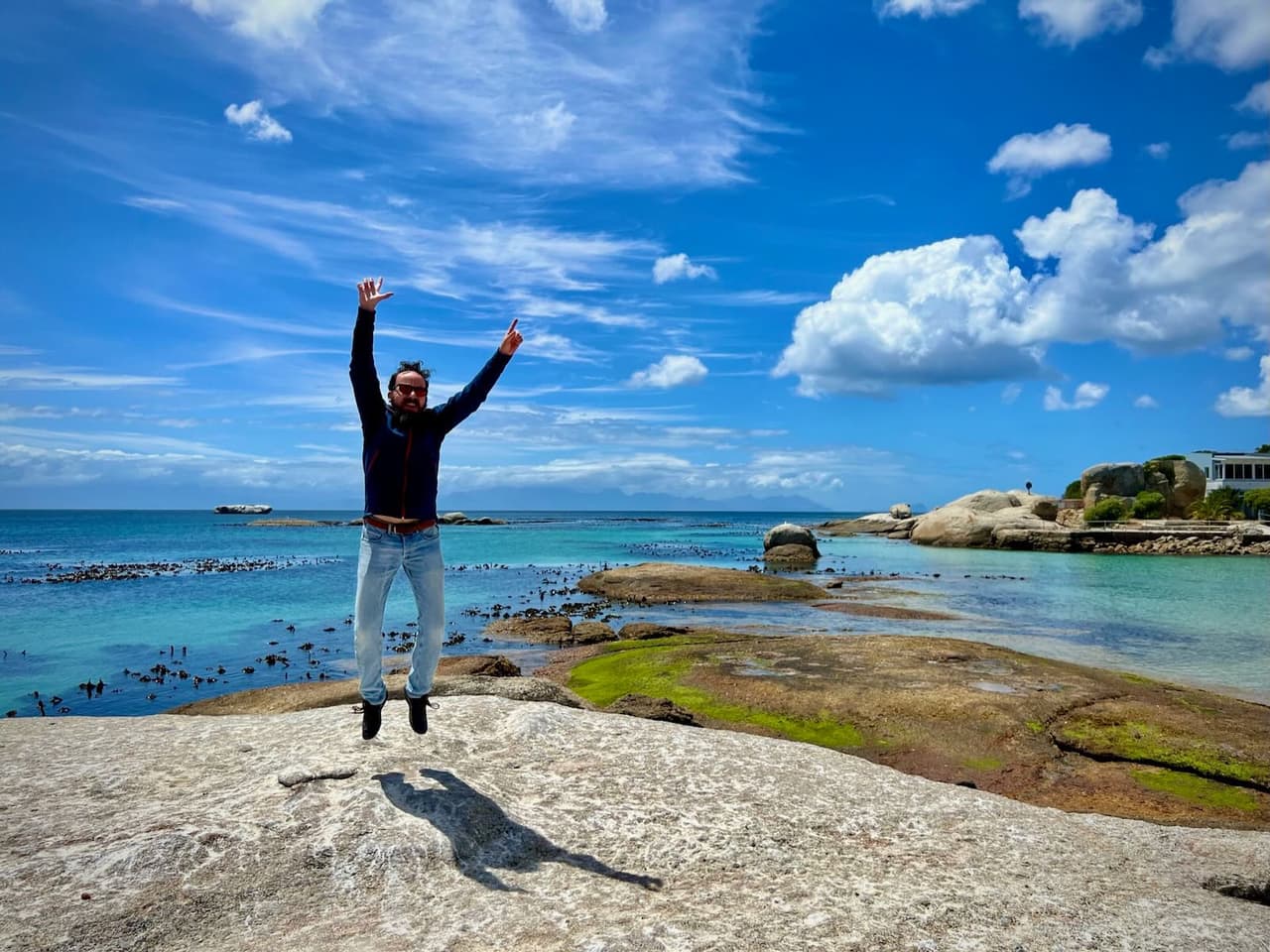 Jumping in Boulder's beach close to the penguins