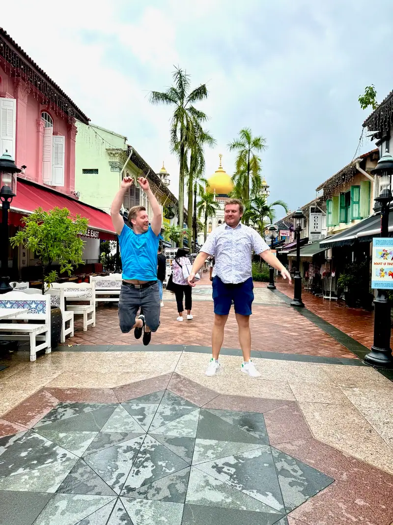 Sylvain and Laurent jumping in front of Sultan Mosque in Singapore