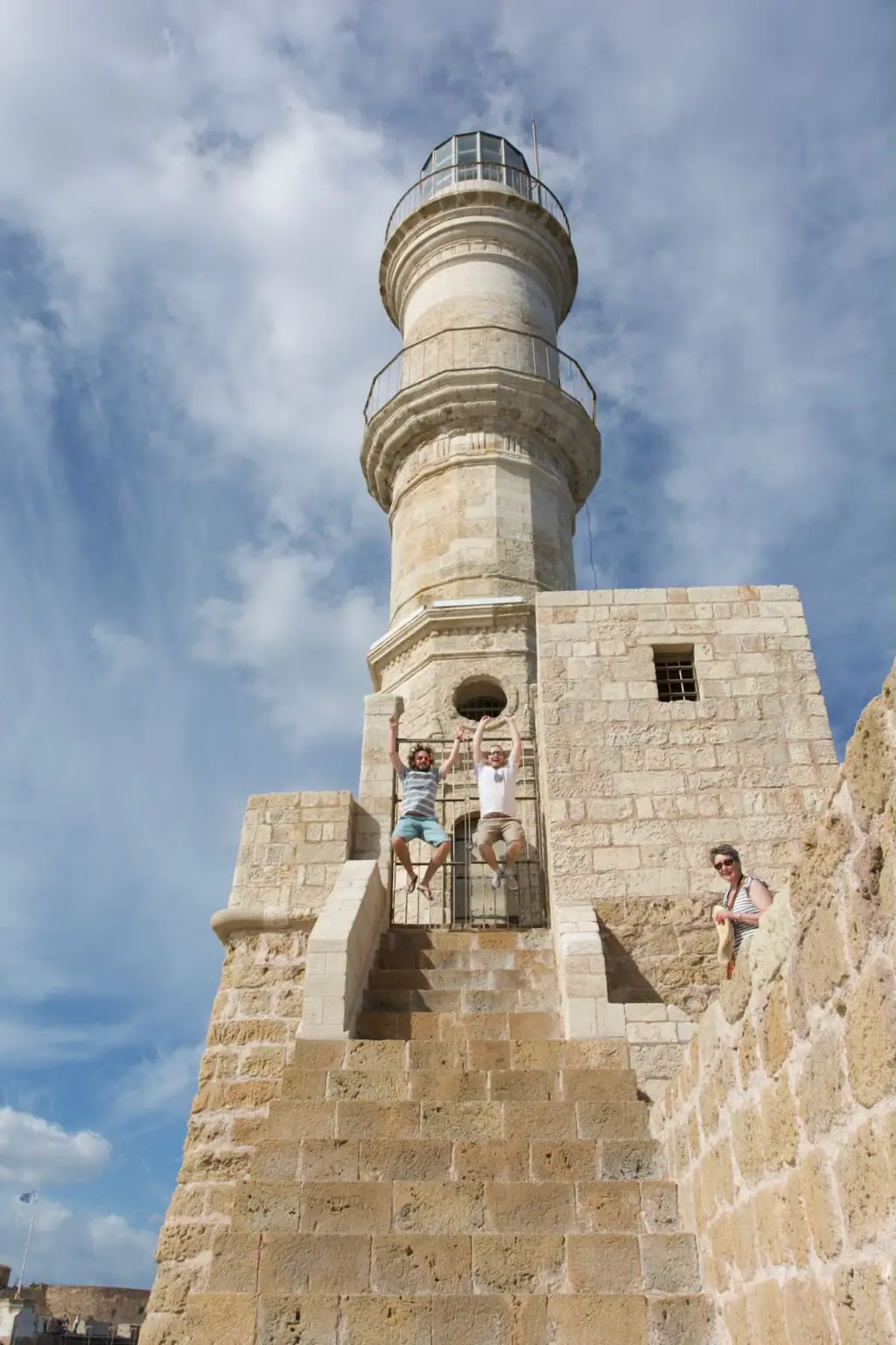 Sylvain and I jumping on the stairs of the lighthouse in Chania