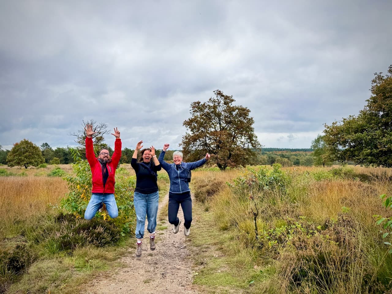 Jumping with J.'s family on a heathland trail in De Hoge Veluwe National Park